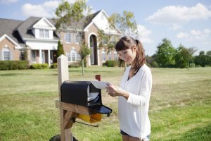 woman checking mail box